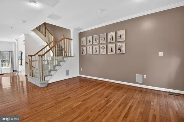 a view of an entryway with wooden floor
