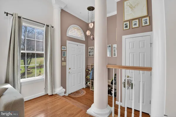 a view of front door with wooden floor