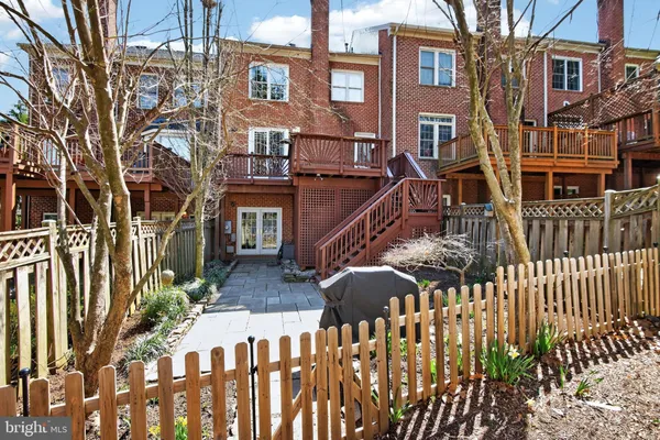 a view of balcony with wooden floor and fence