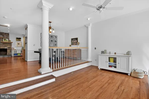 a view of a livingroom with furniture and hardwood floor