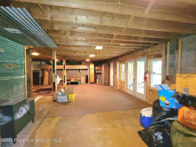 a storage room with water heater and racks