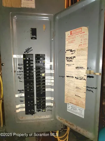 a view of a patio with table and chairs and couches with wooden floor