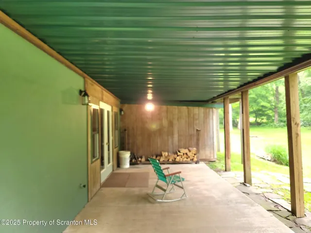 a view of a backyard with a small cabin