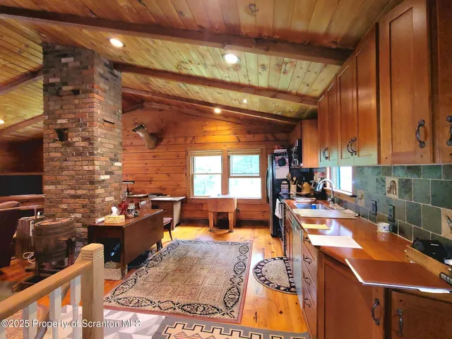 a living room with furniture a rug and a fireplace