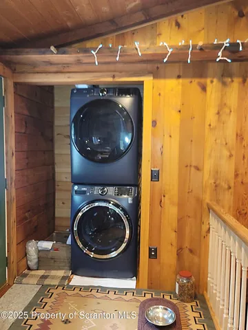 a bedroom with a large bed and a large window