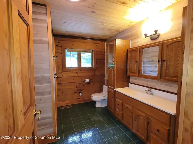 a bathroom with a glass shower door