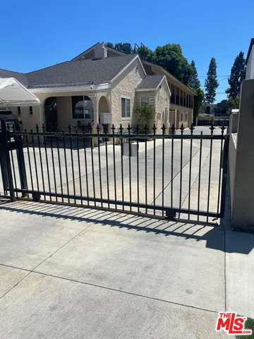 a front view of a house with a fence