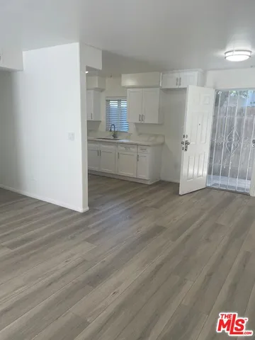 a view of kitchen with wooden floor