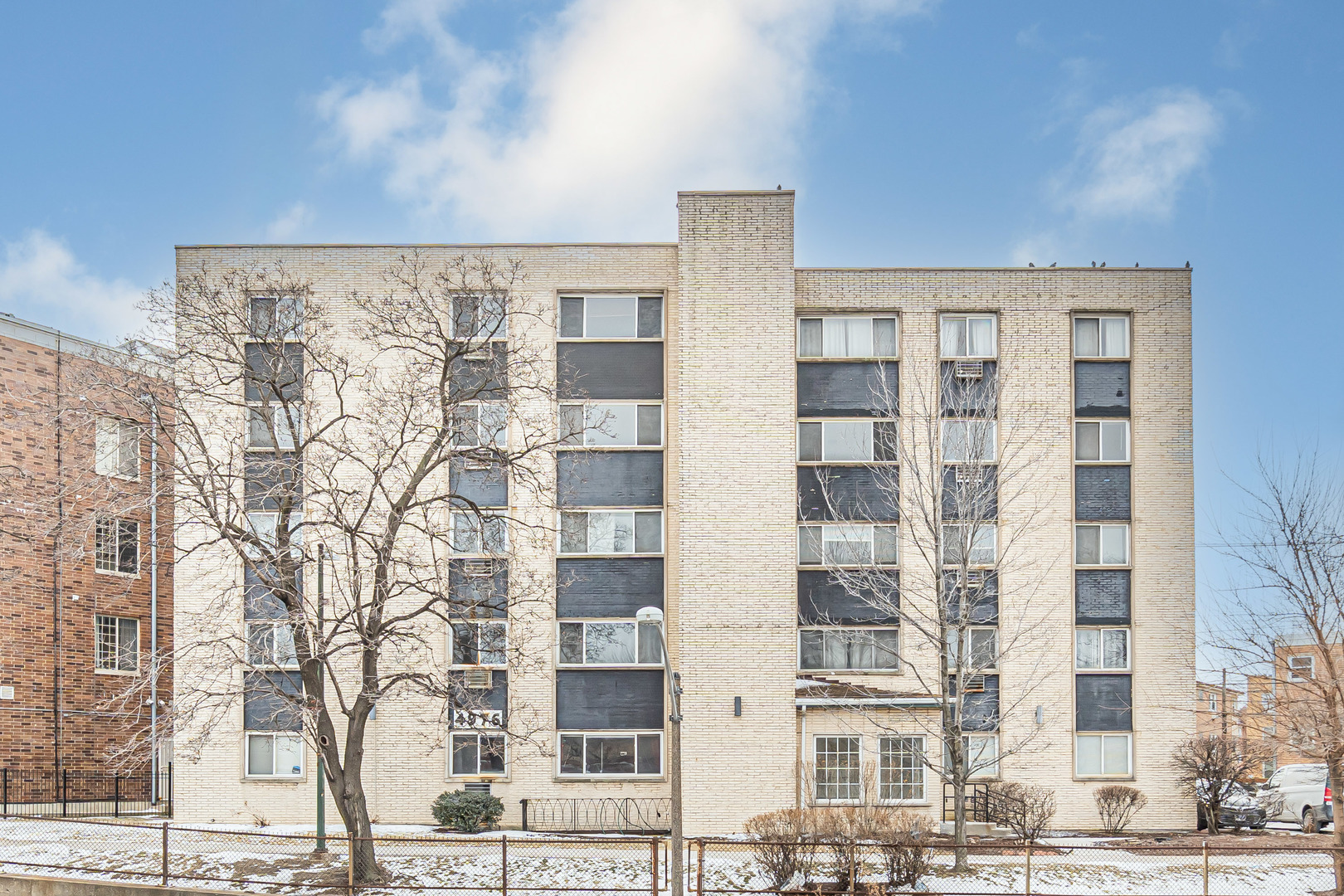 4976 North Milwaukee Avenue, Unit 401 Chicago, IL 60630 - Photo 1 of 23 a front view of a building