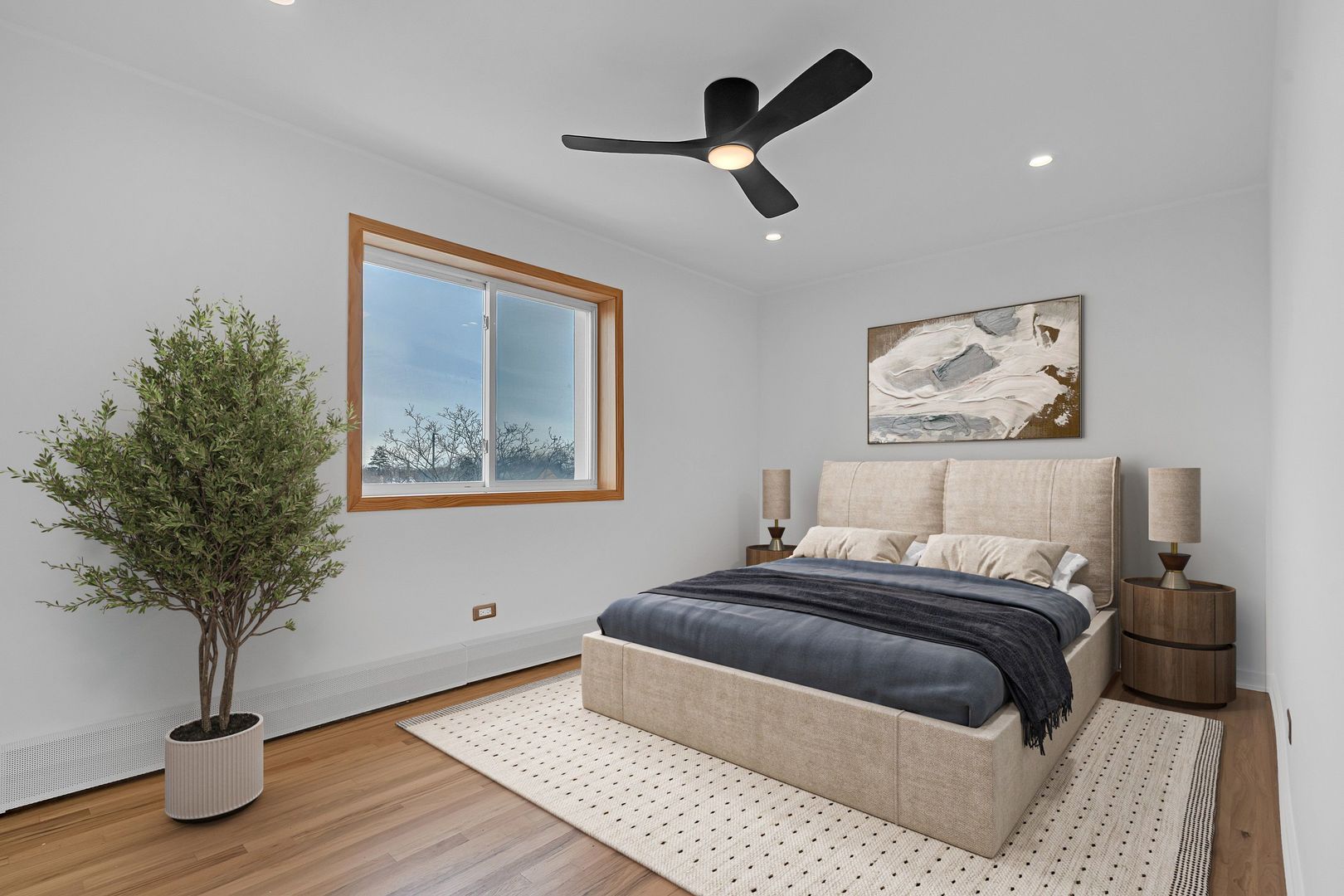 4976 North Milwaukee Avenue, Unit 401 Chicago, IL 60630 - Photo 14 of 23 a bedroom with a large bed and a potted plant