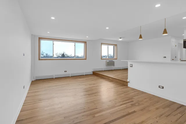 a kitchen with a stove microwave and sink
