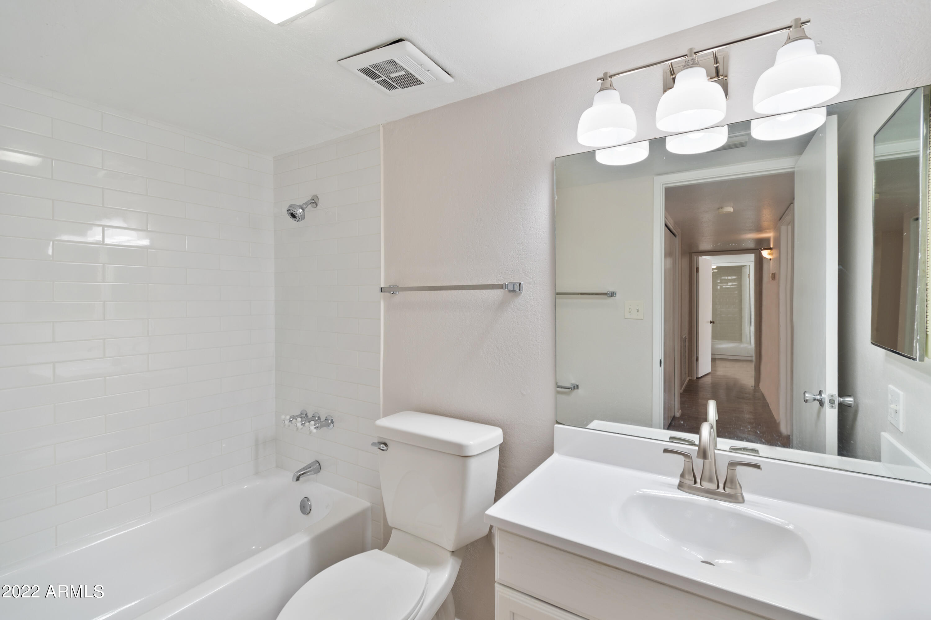 2044 South Rural Road, Unit B Tempe, AZ 85282 - Photo 4 of 16 a bathroom with a sink a toilet and shower