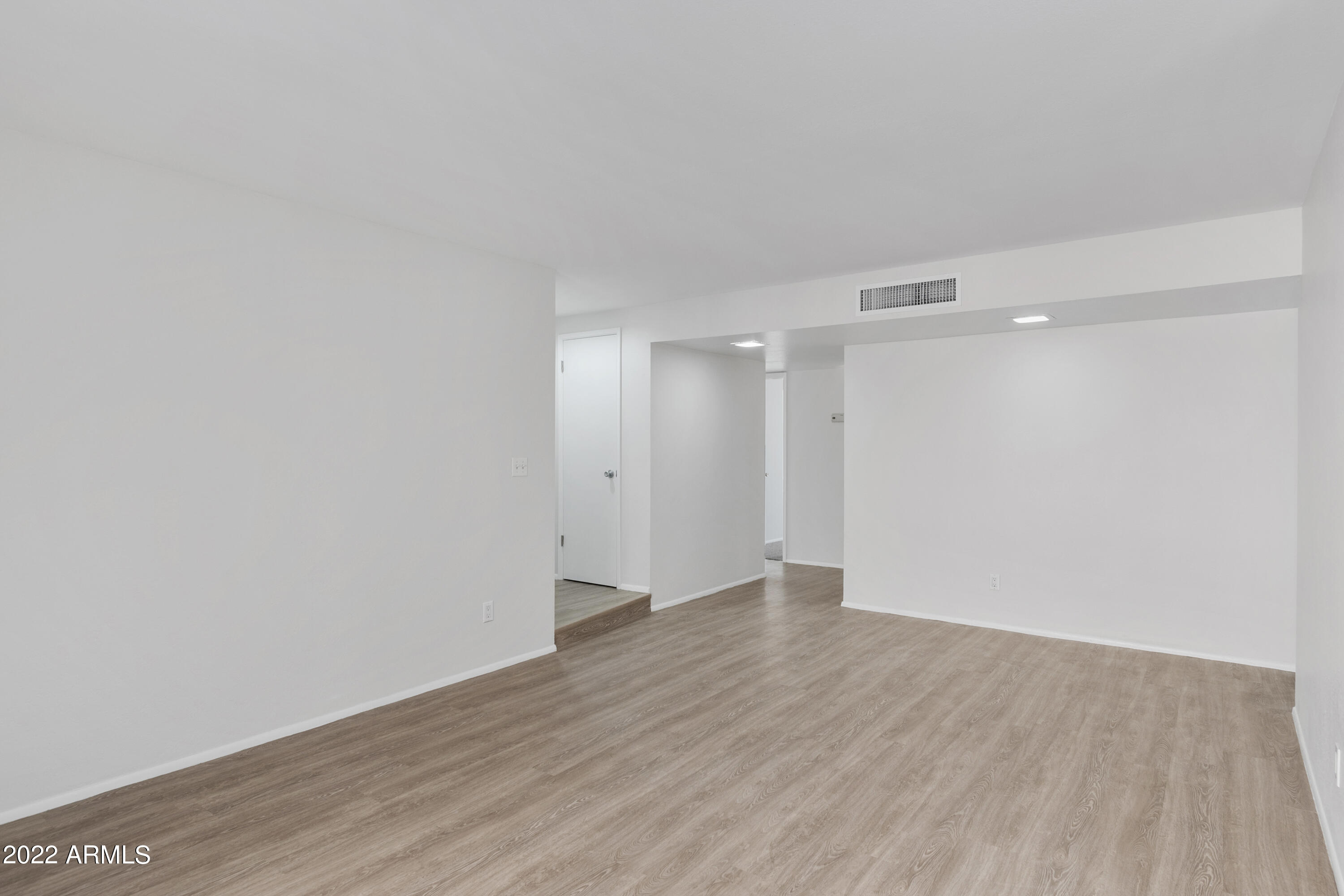 2044 South Rural Road, Unit B Tempe, AZ 85282 - Photo 8 of 16 a view of an empty room with wooden floor