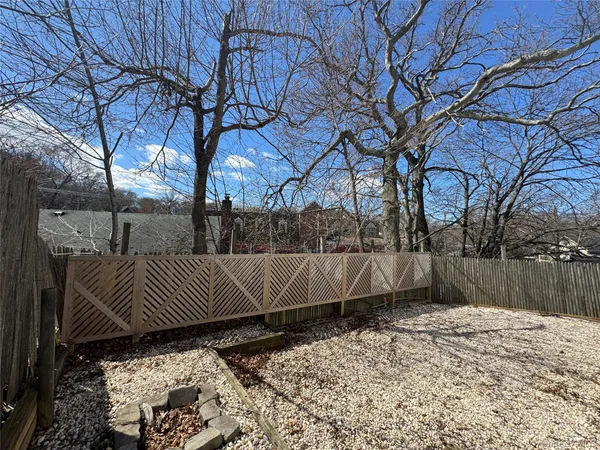 a view of backyard and trees