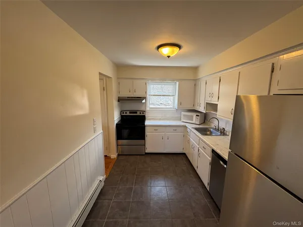 a kitchen with a refrigerator a sink and dishwasher