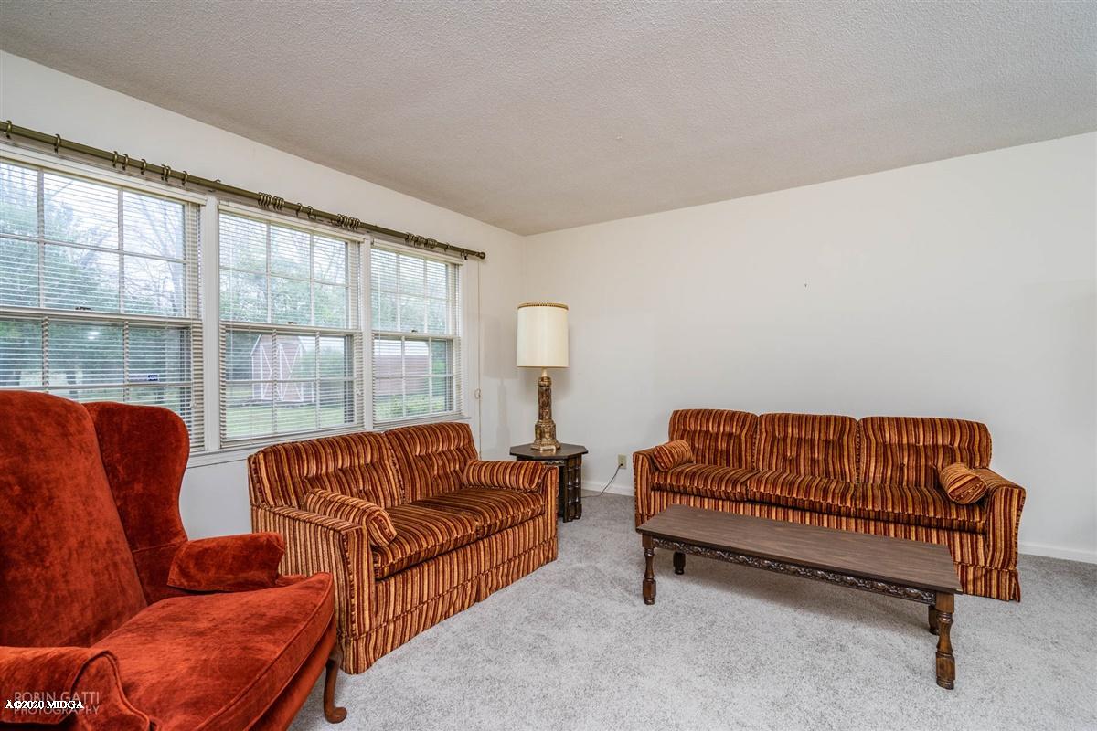 3880 Hartley Bridge Road Macon, GA 31216 - Photo 22 of 32 a living room with furniture and a window
