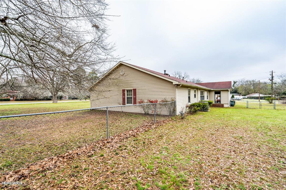 3880 Hartley Bridge Road Macon, GA 31216 - Photo 8 of 32 a view of a house with a yard