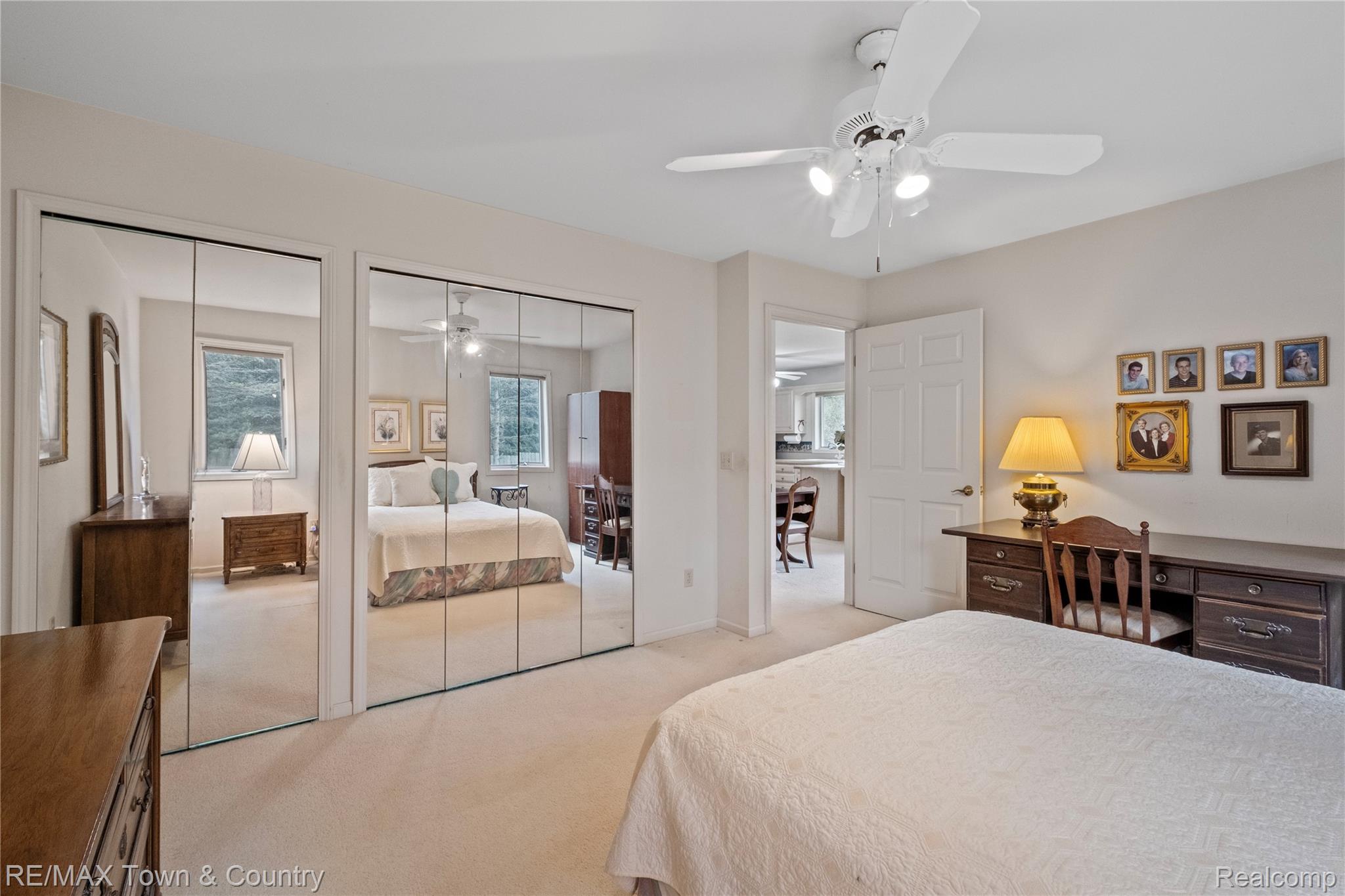 5464 North Seymour Road Flushing, MI 48433 - Photo 28 of 45 Ceiling fan with integrated lighting, carpeted flooring, and mirrored closet doors