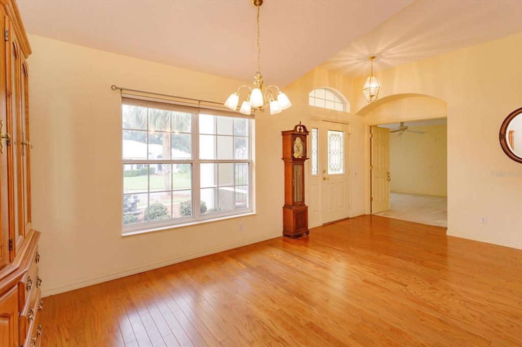 5151 Indian Ocean Loop Tavares, FL 32778 - Photo 11 of 28 a view of a room with window and wooden floor
