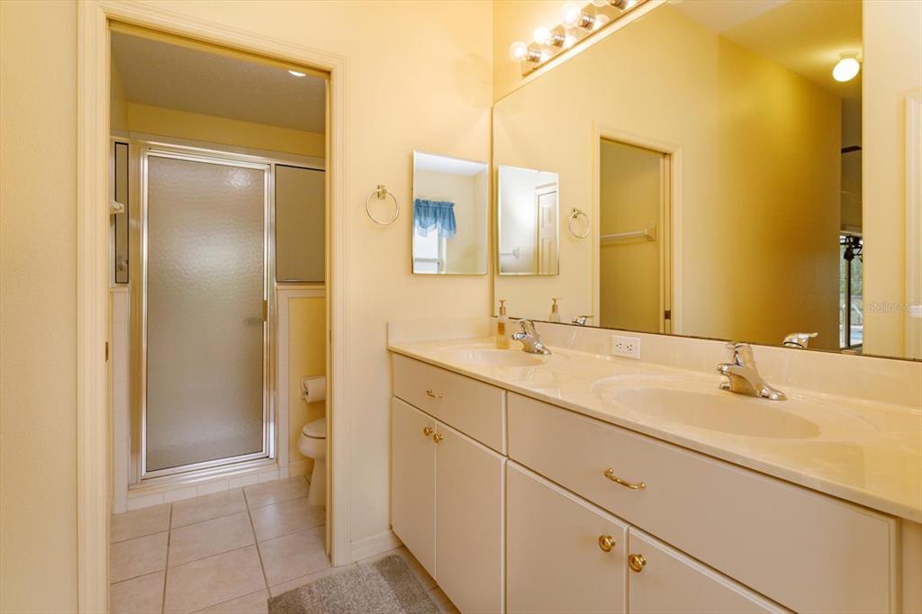 5151 Indian Ocean Loop Tavares, FL 32778 - Photo 18 of 28 a bathroom with a sink and a mirror