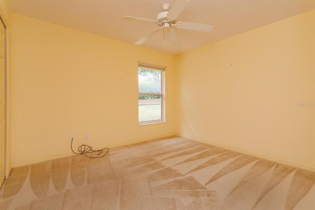5151 Indian Ocean Loop Tavares, FL 32778 - Photo 20 of 28 a view of an empty room with a window