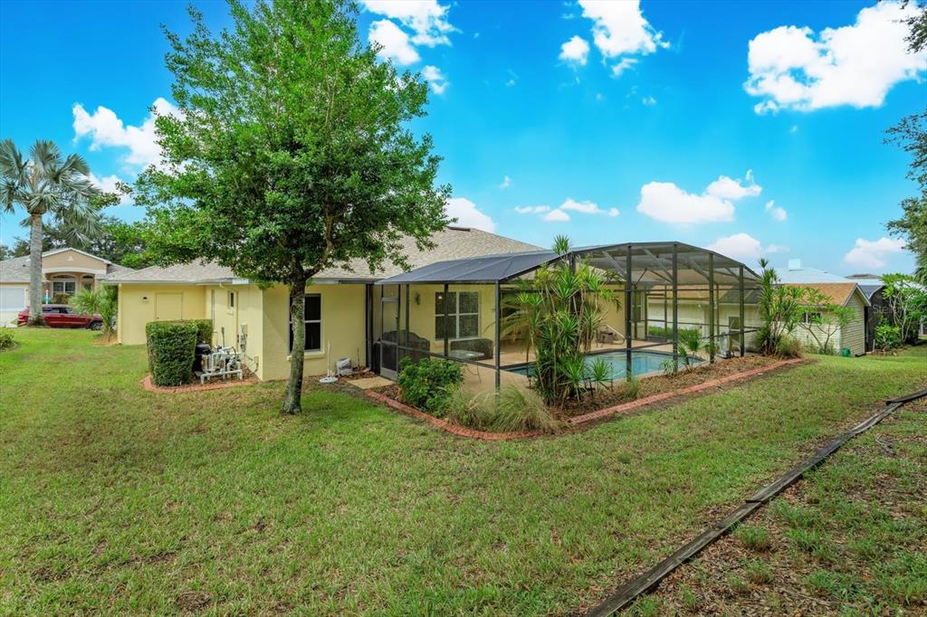 5151 Indian Ocean Loop Tavares, FL 32778 - Photo 2 of 28 a view of a house with backyard