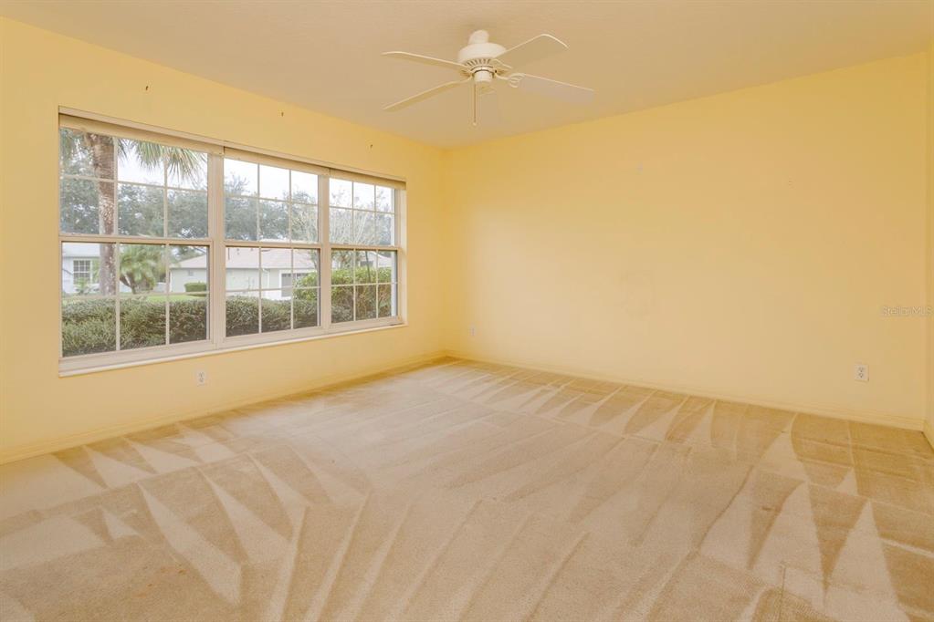 5151 Indian Ocean Loop Tavares, FL 32778 - Photo 23 of 28 a view of an empty room with a window