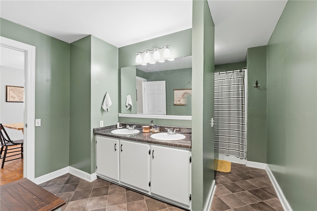 108 Tarrant Street Central, SC 29630 - Photo 21 of 42 A generous double vanity and shower in this practical, well-appointed bathroom.