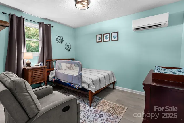 a bedroom with furniture and windows