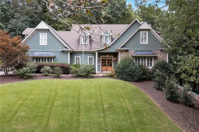 a front view of a house with garden