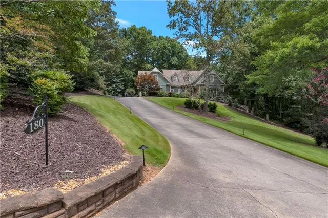 a view of a park with large trees