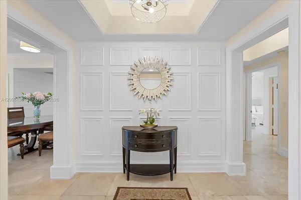 a living room with furniture a dining table and a fireplace