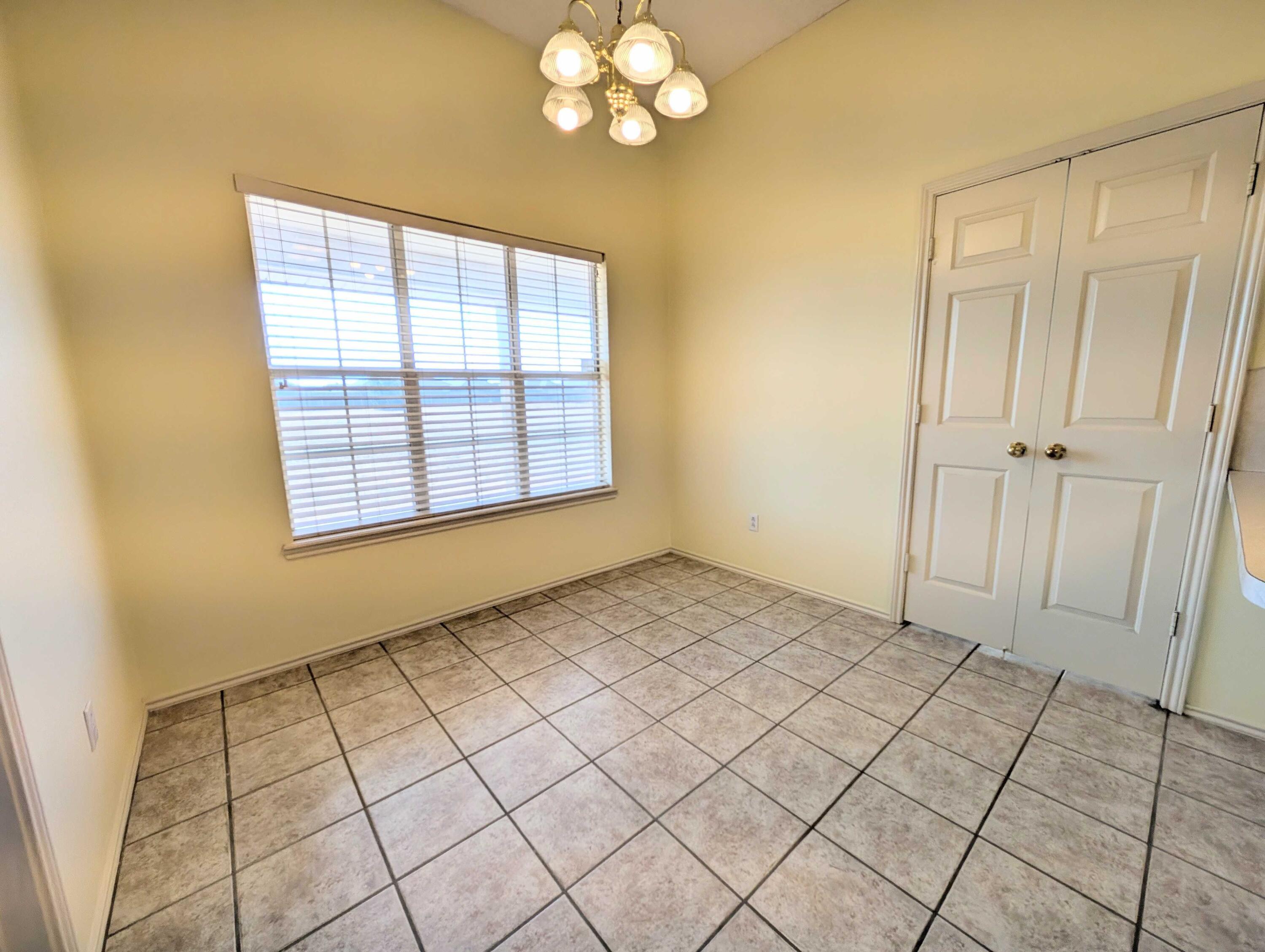 8909 19th Street Lubbock, TX 79407 - Photo 12 of 13 a view of an empty room and window