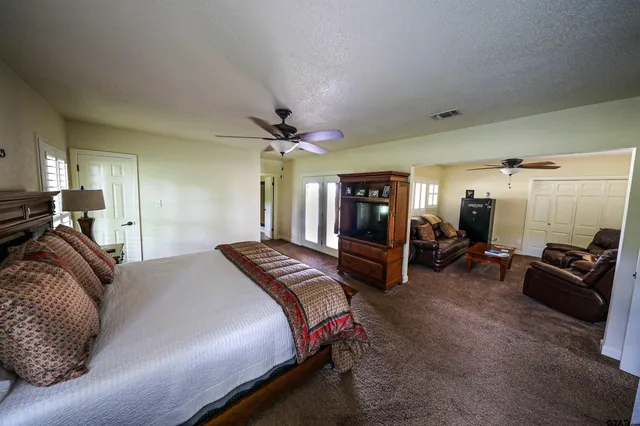 a bed room with a bed and furniture