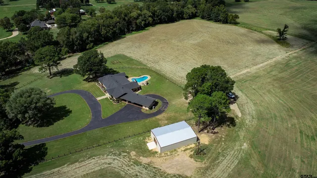 an aerial view of a house with outdoor space