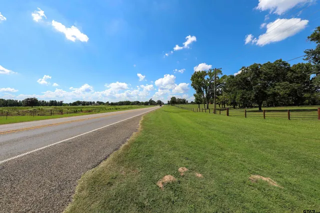 a view of a golf course with a lake