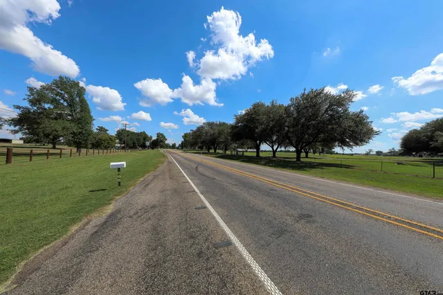 a view of a golf course with a lake view