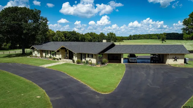 a view of a house with a big yard