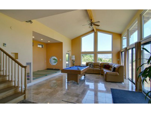 1770 Paradise View Road Morgan Hill, CA 95037 - Photo 3 of 12 a living room with furniture a large window and a chandelier