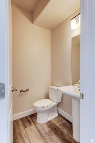668 East Fiddlers Canyon Road, Unit 24 Cedar City, UT 84721 - Photo 14 of 21 Bathroom with light wood-style floors and toilet