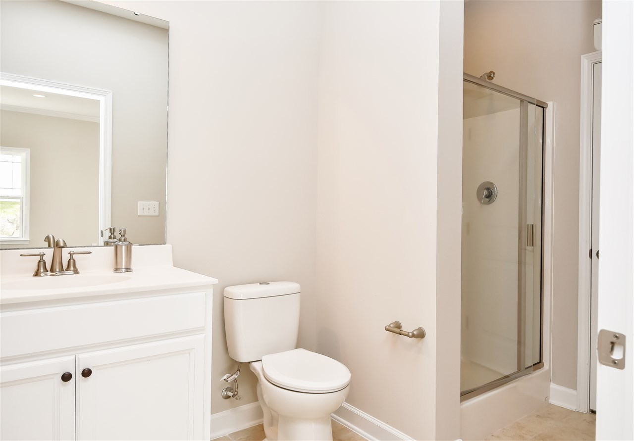 5511 Nur Lane Raleigh, NC 27606 - Photo 12 of 25 1st Floor full bathroom