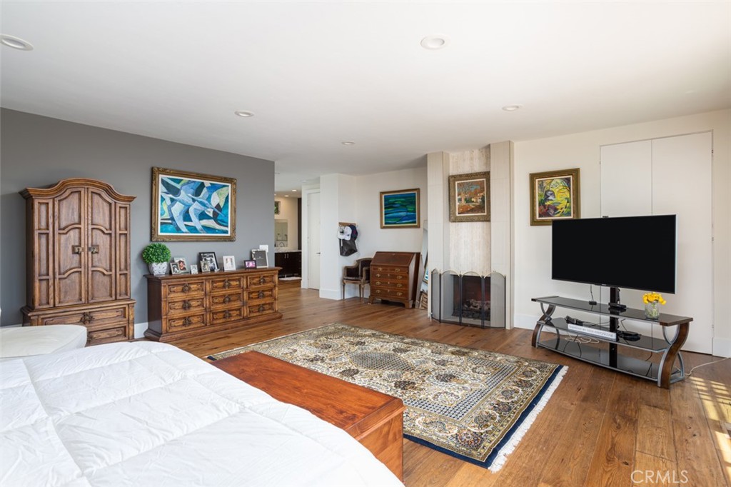 1401 Emerald Bay Laguna Beach, CA 92651 - Photo 13 of 28 a bedroom with furniture and a flat screen tv