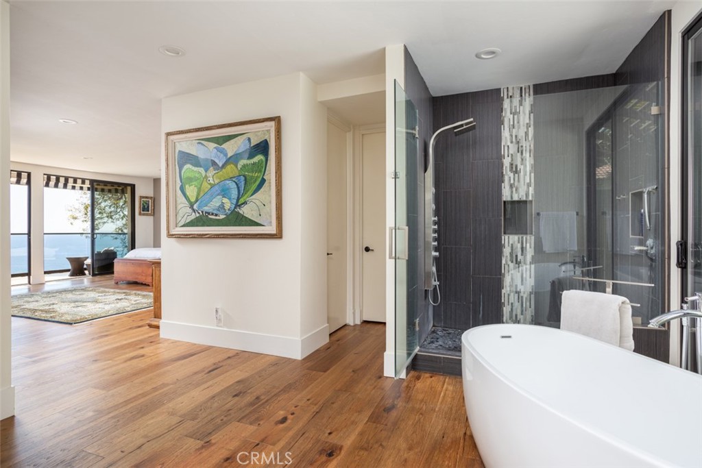 1401 Emerald Bay Laguna Beach, CA 92651 - Photo 15 of 28 a bathroom with a bathtub a toilet and a shower
