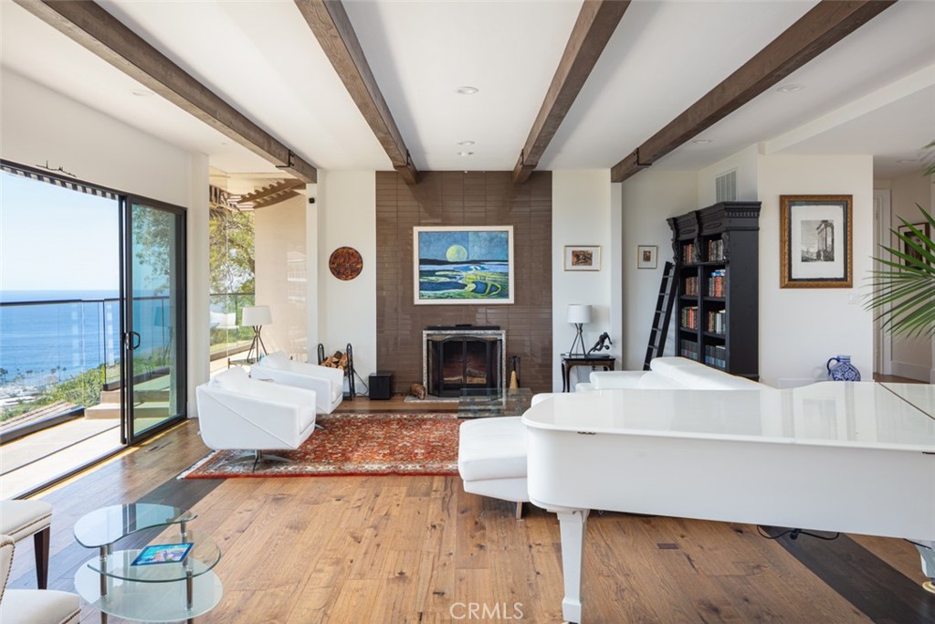 1401 Emerald Bay Laguna Beach, CA 92651 - Photo 2 of 28 a living room with furniture and a fireplace
