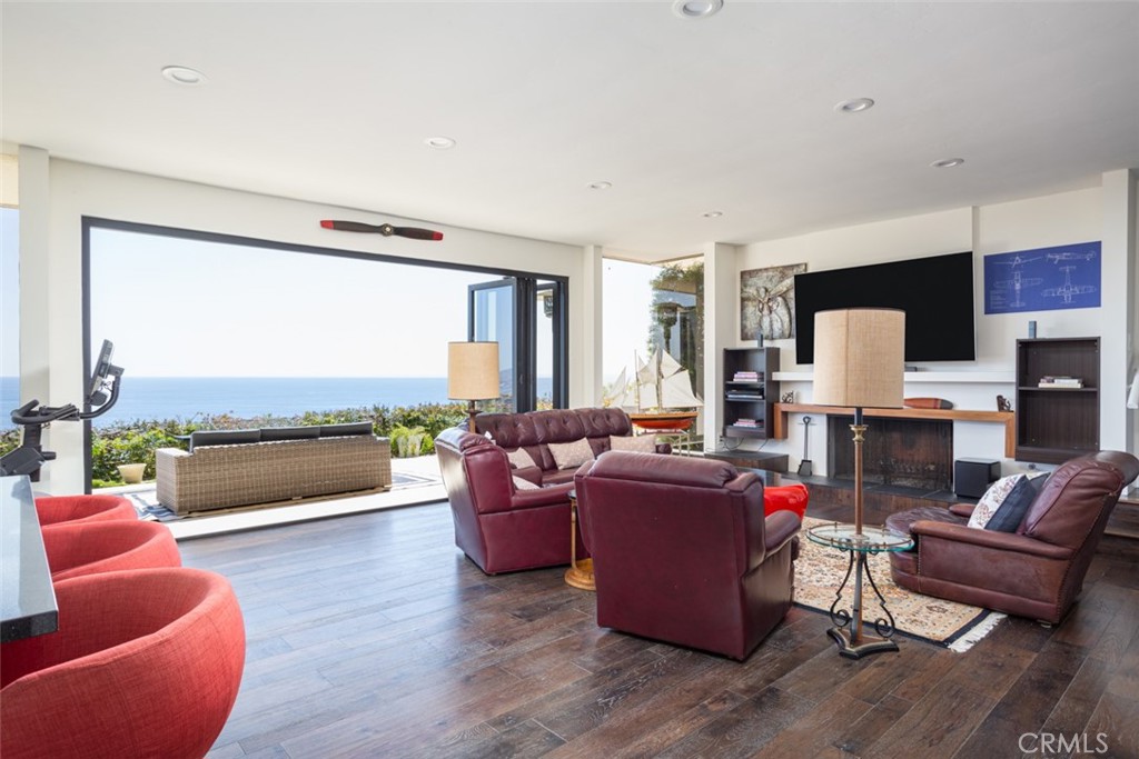 1401 Emerald Bay Laguna Beach, CA 92651 - Photo 23 of 28 a living room with furniture and a large window