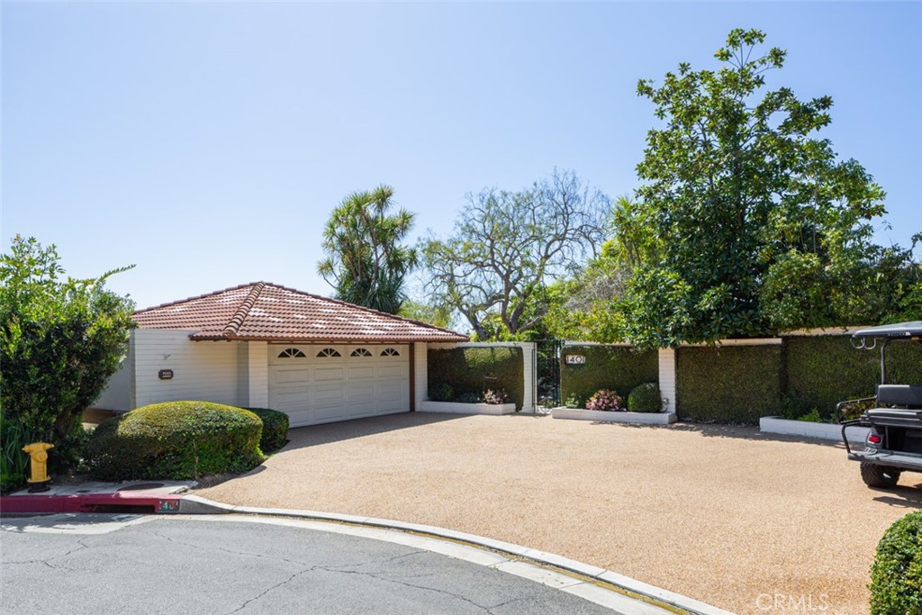 1401 Emerald Bay Laguna Beach, CA 92651 - Photo 26 of 28 a backyard of a house with large trees and plants