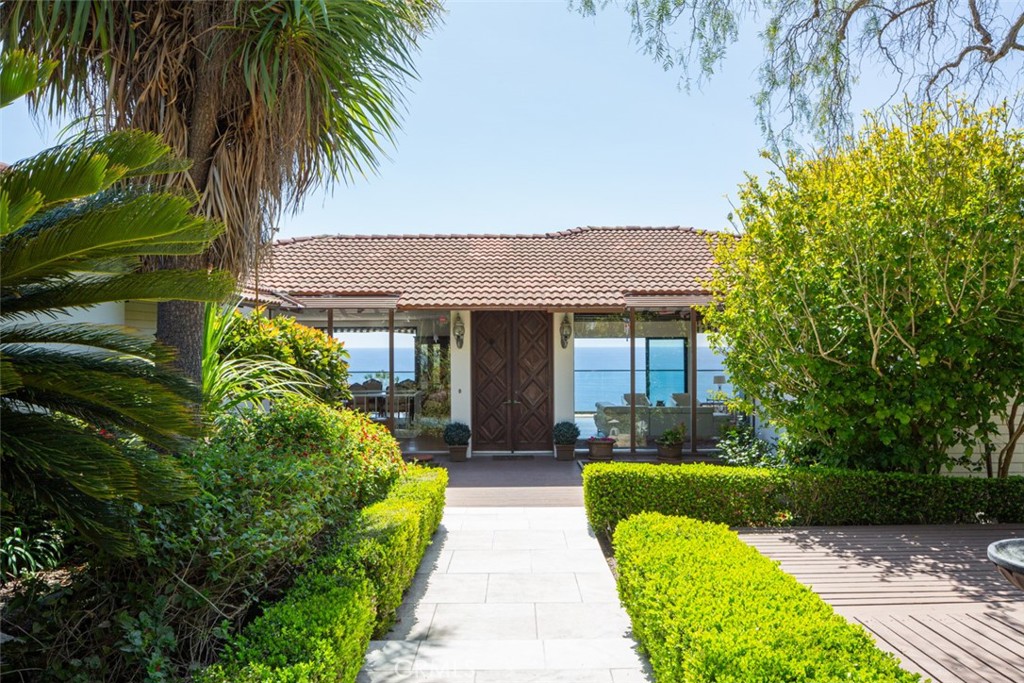 1401 Emerald Bay Laguna Beach, CA 92651 - Photo 28 of 28 a front view of a house with garden