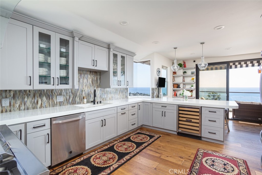 1401 Emerald Bay Laguna Beach, CA 92651 - Photo 10 of 28 a kitchen with cabinets and sink