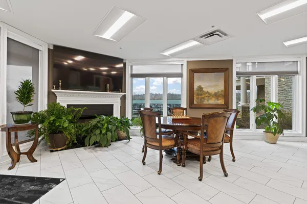 a view of a dining room with furniture and front door