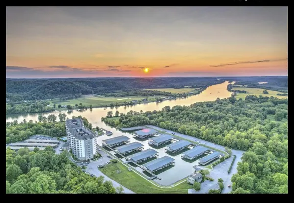 a view of a balcony with furniture and a floor to ceiling window